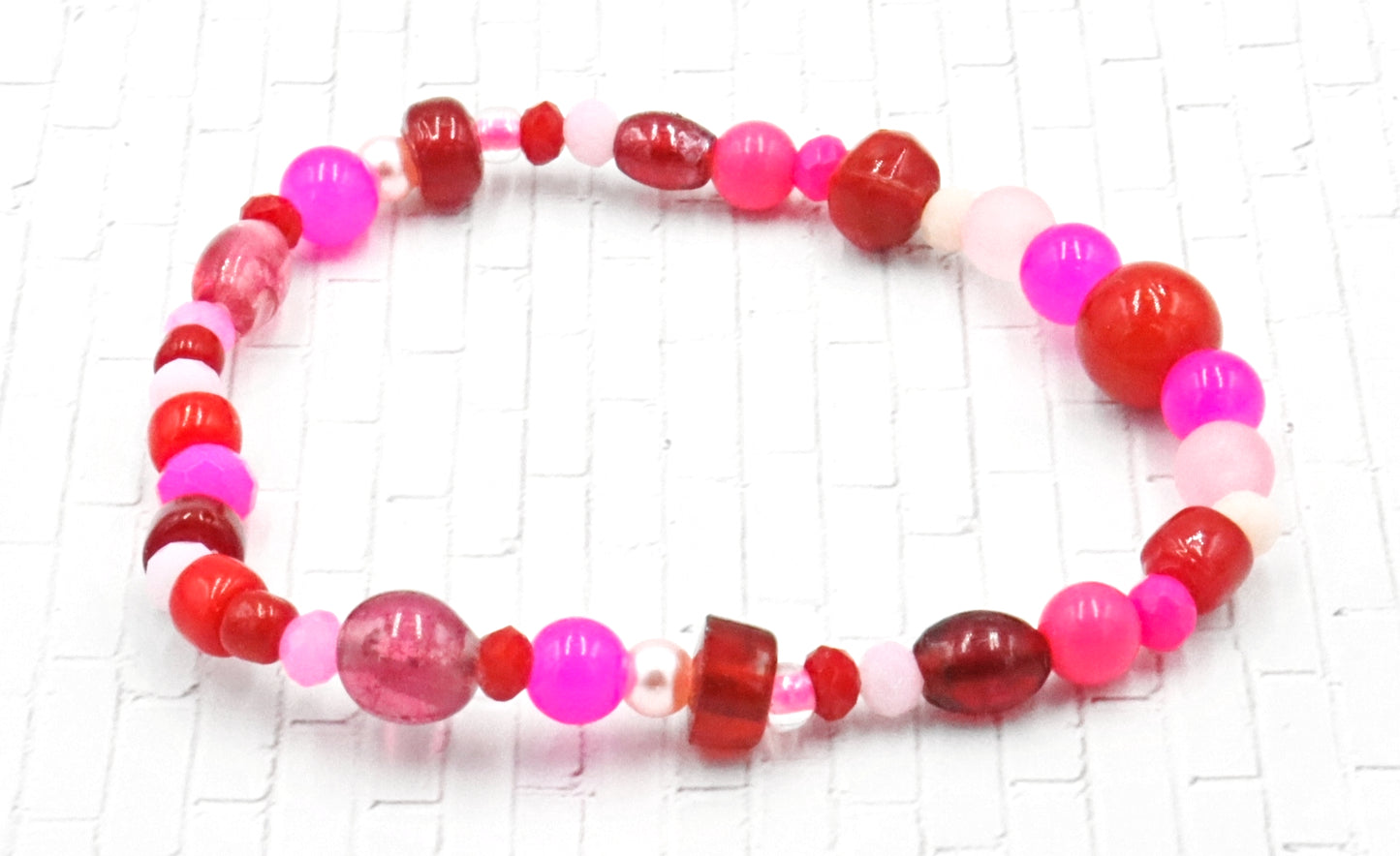 A Bite Out of Our Cherry Hot Pink and Various Red Glass Beaded Bracelet by Monkeys Mojo