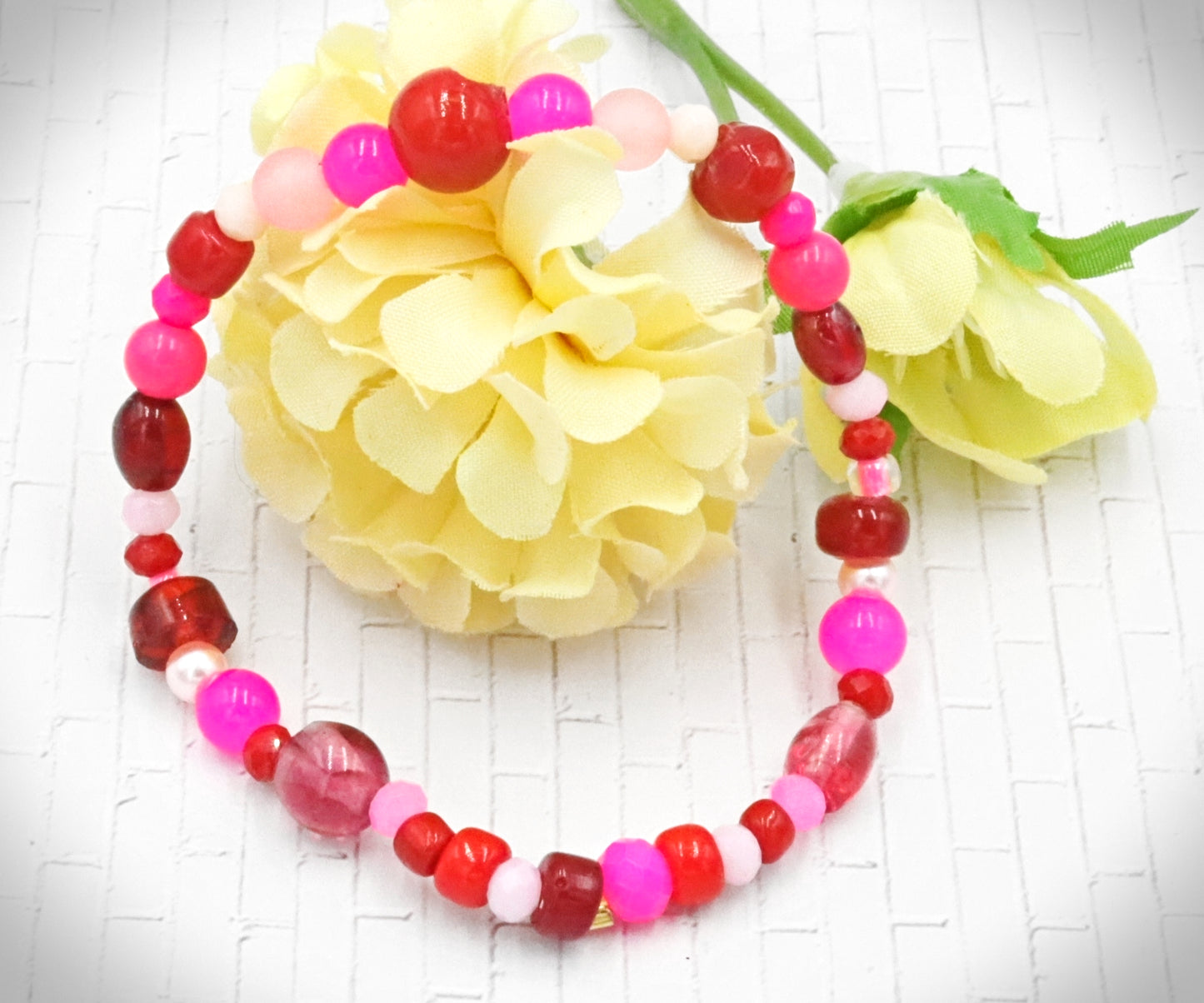 A Bite Out of Our Cherry Hot Pink and Various Red Glass Beaded Bracelet by Monkeys Mojo