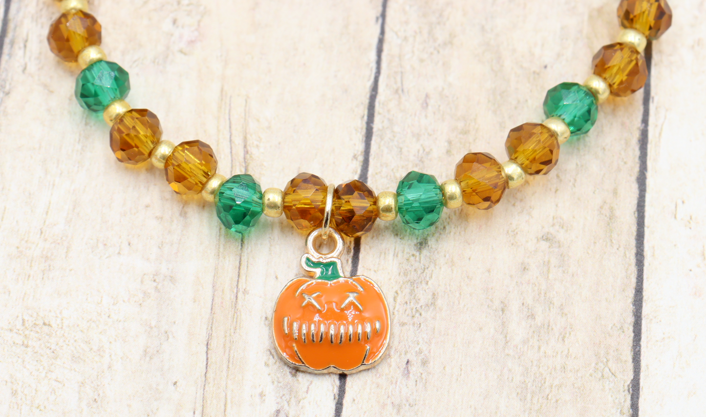 Faceted Orange and Green Scary Craved Pumpkin Patch Stretch Charm Bracelet by Monkeys Mojo