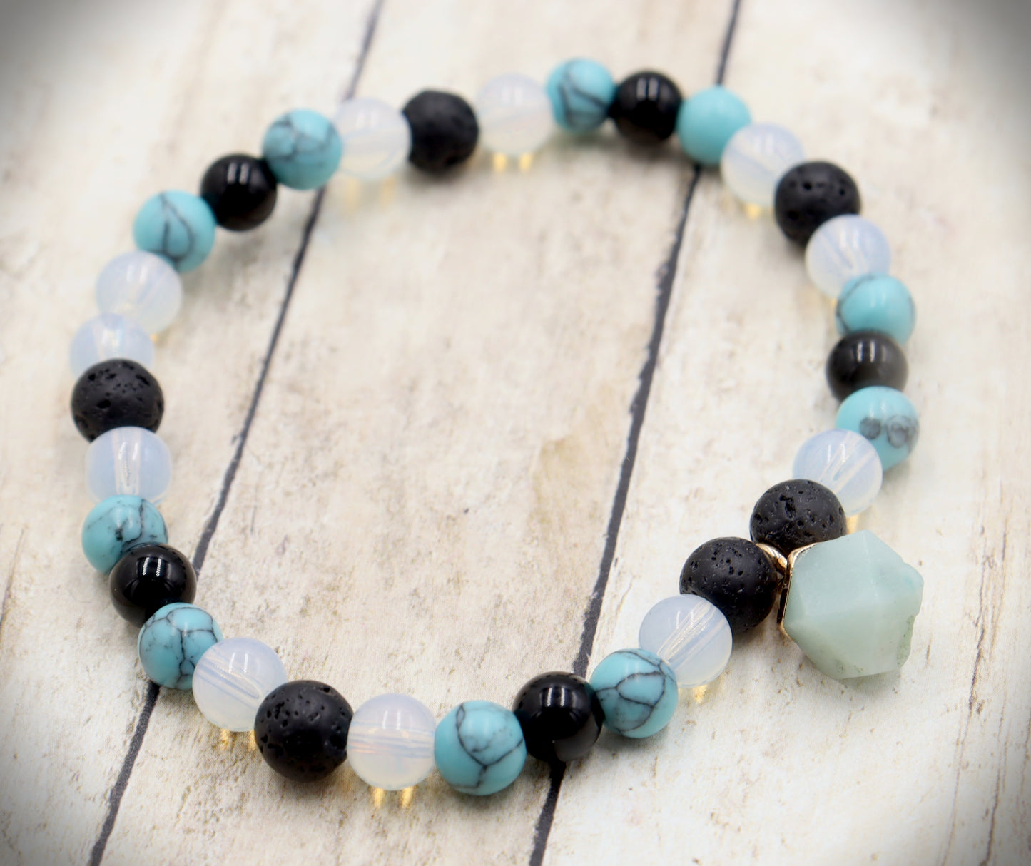 Head Over the Moon for Turquoise Blue and Black Lava Rock Golden Geometric Charm Bracelet