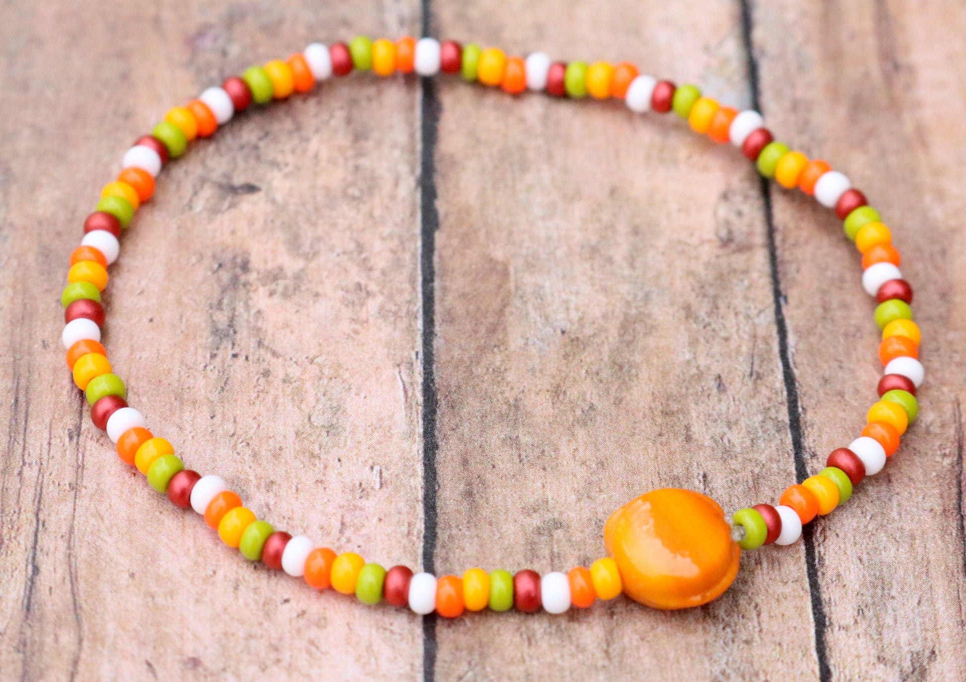 Fall in Love with A Glass Orange Sun - Red, Yellow, Green, and White Glass Bracelet Front View