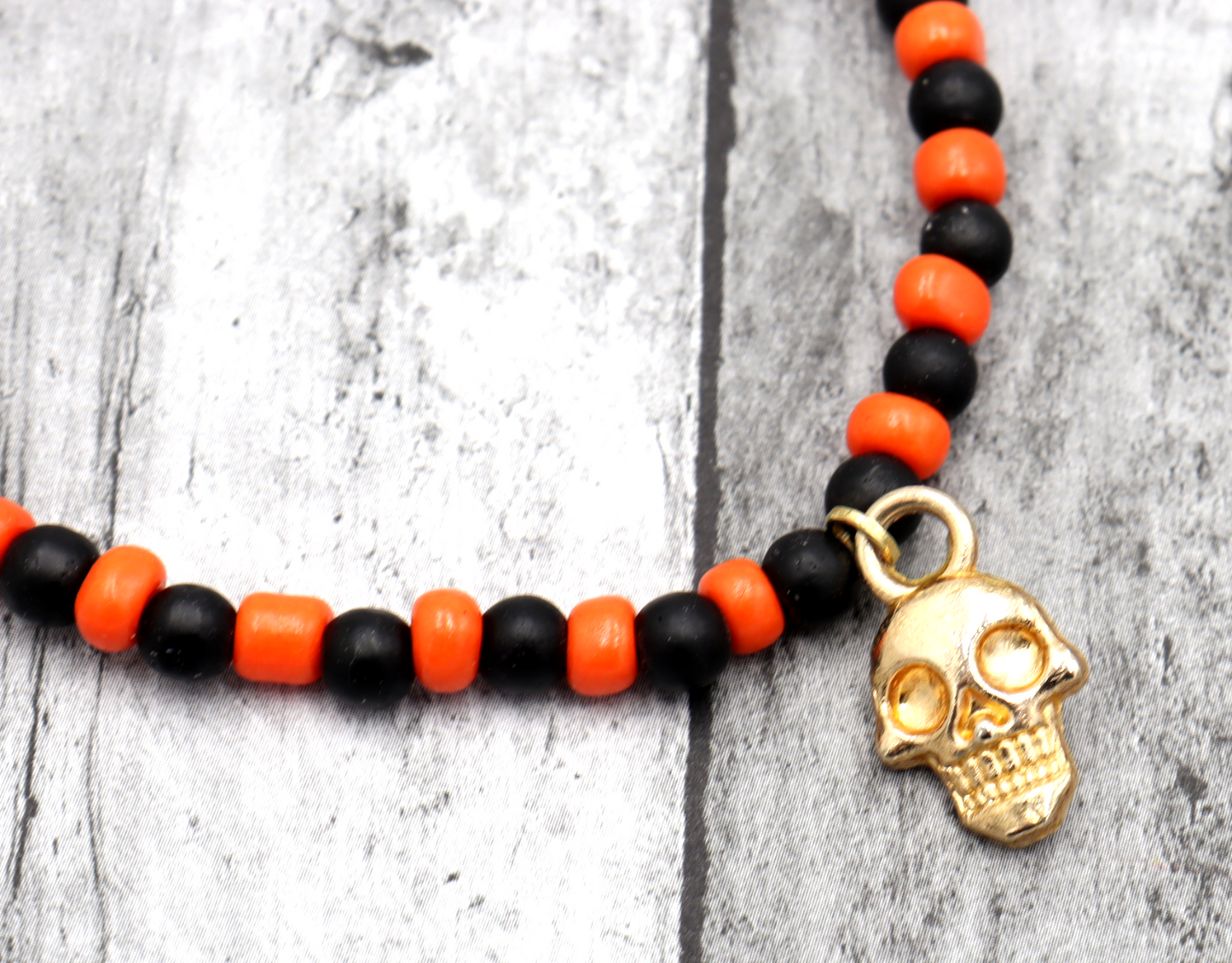 Classic Orange and Black Trick or Treat Yellow Gold Tone Skull Charm Halloween Stretch Bracelet by Monkey's Mojo