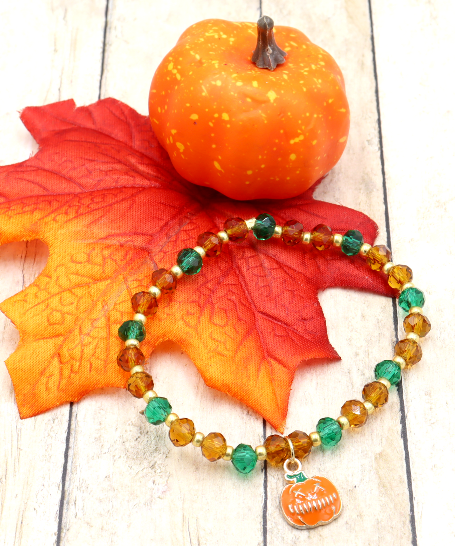 Faceted Orange and Green Scary Craved Pumpkin Patch Stretch Charm Bracelet by Monkeys Mojo