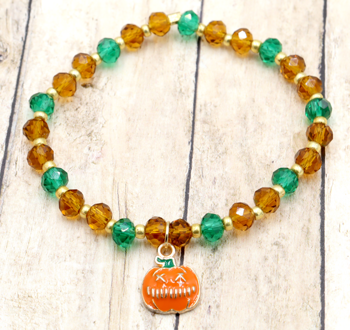 Faceted Orange and Green Scary Craved Pumpkin Patch Stretch Charm Bracelet by Monkeys Mojo