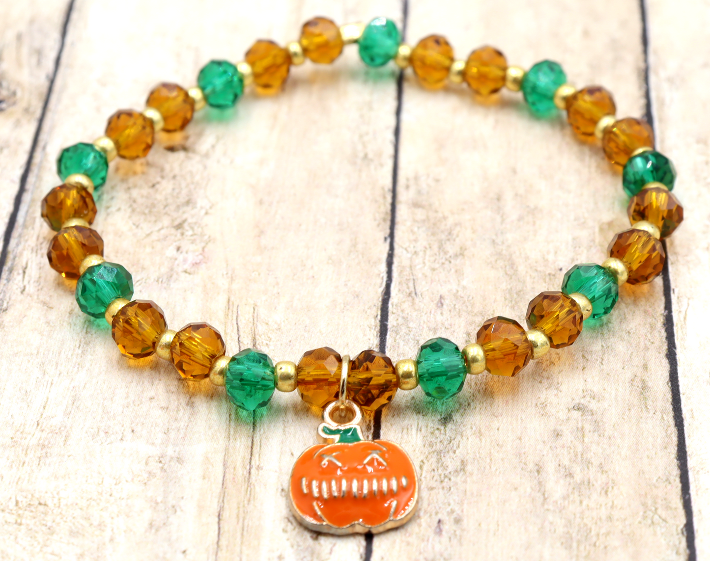 Faceted Orange and Green Scary Craved Pumpkin Patch Stretch Charm Bracelet by Monkeys Mojo