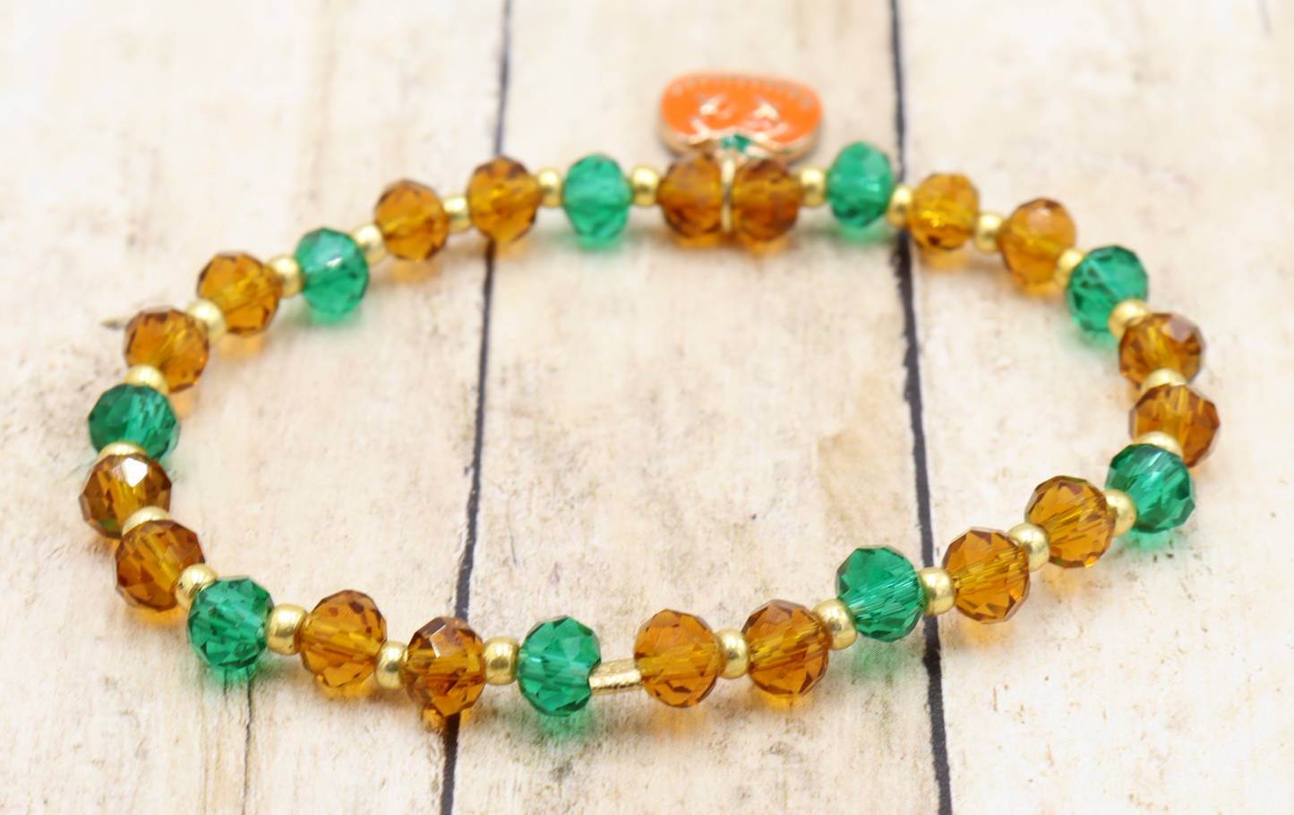 Faceted Orange and Green Scary Craved Pumpkin Patch Stretch Charm Bracelet by Monkeys Mojo