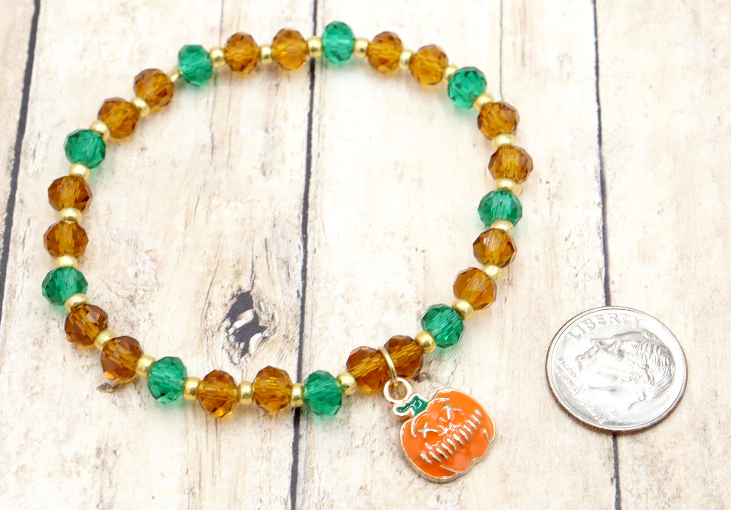 Faceted Orange and Green Scary Craved Pumpkin Patch Stretch Charm Bracelet by Monkeys Mojo