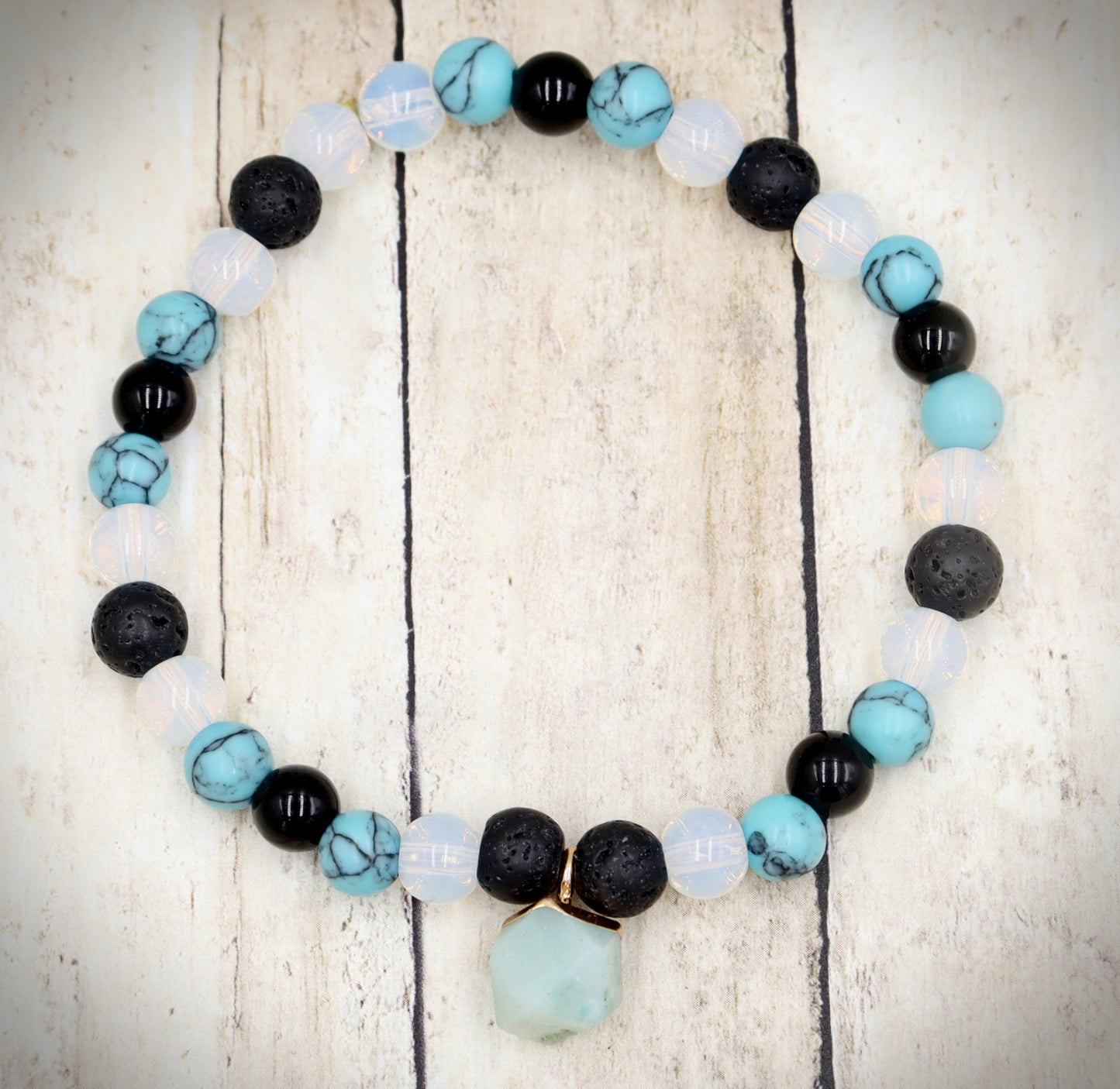 Head Over the Moon for Turquoise Blue and Black Lava Rock Golden Geometric Charm Bracelet