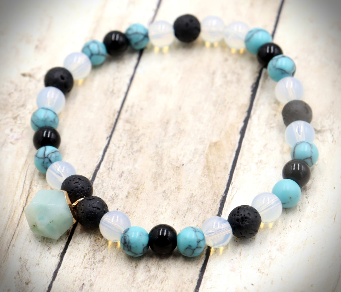 Head Over the Moon for Turquoise Blue and Black Lava Rock Golden Geometric Charm Bracelet