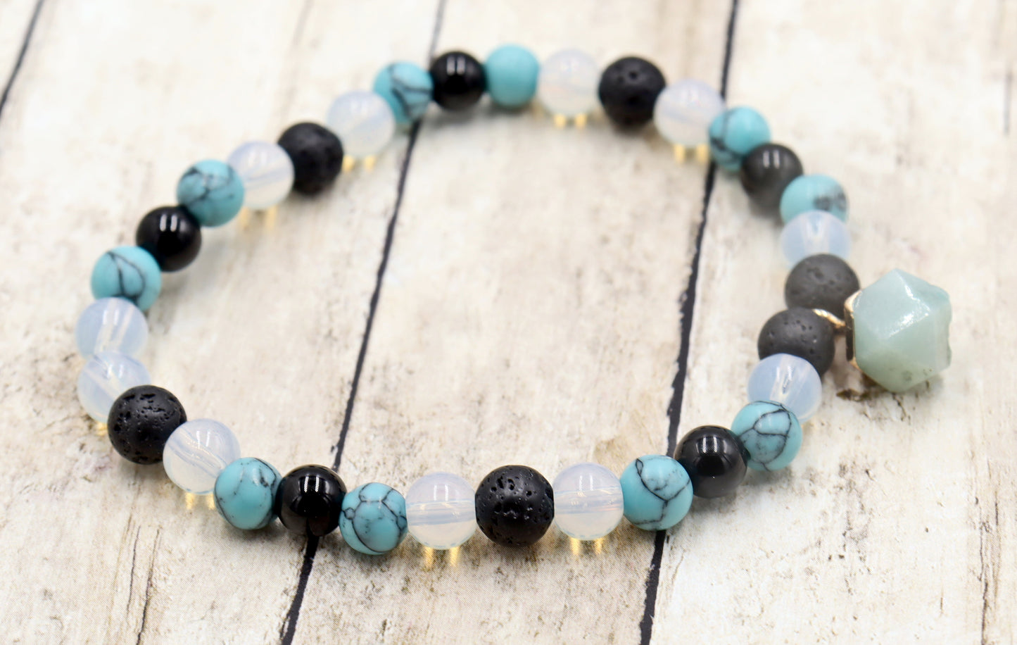 Head Over the Moon for Turquoise Blue and Black Lava Rock Golden Geometric Charm Bracelet