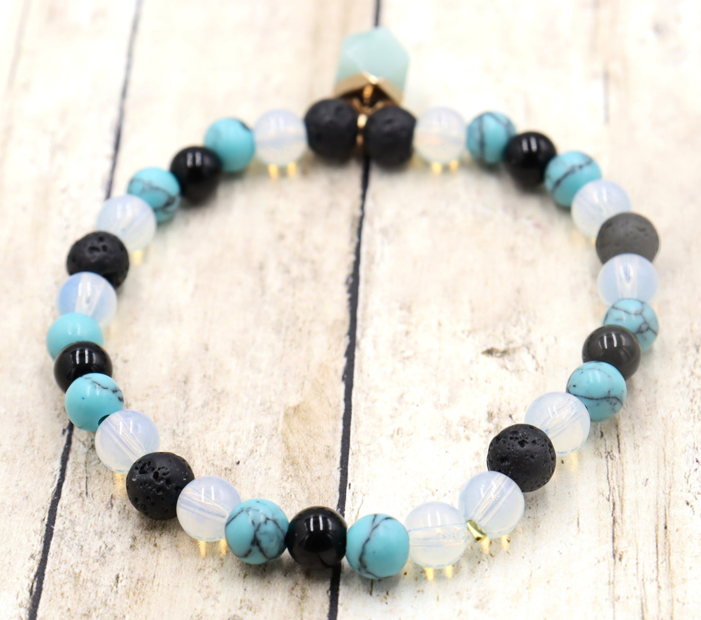 Head Over the Moon for Turquoise Blue and Black Lava Rock Golden Geometric Charm Bracelet