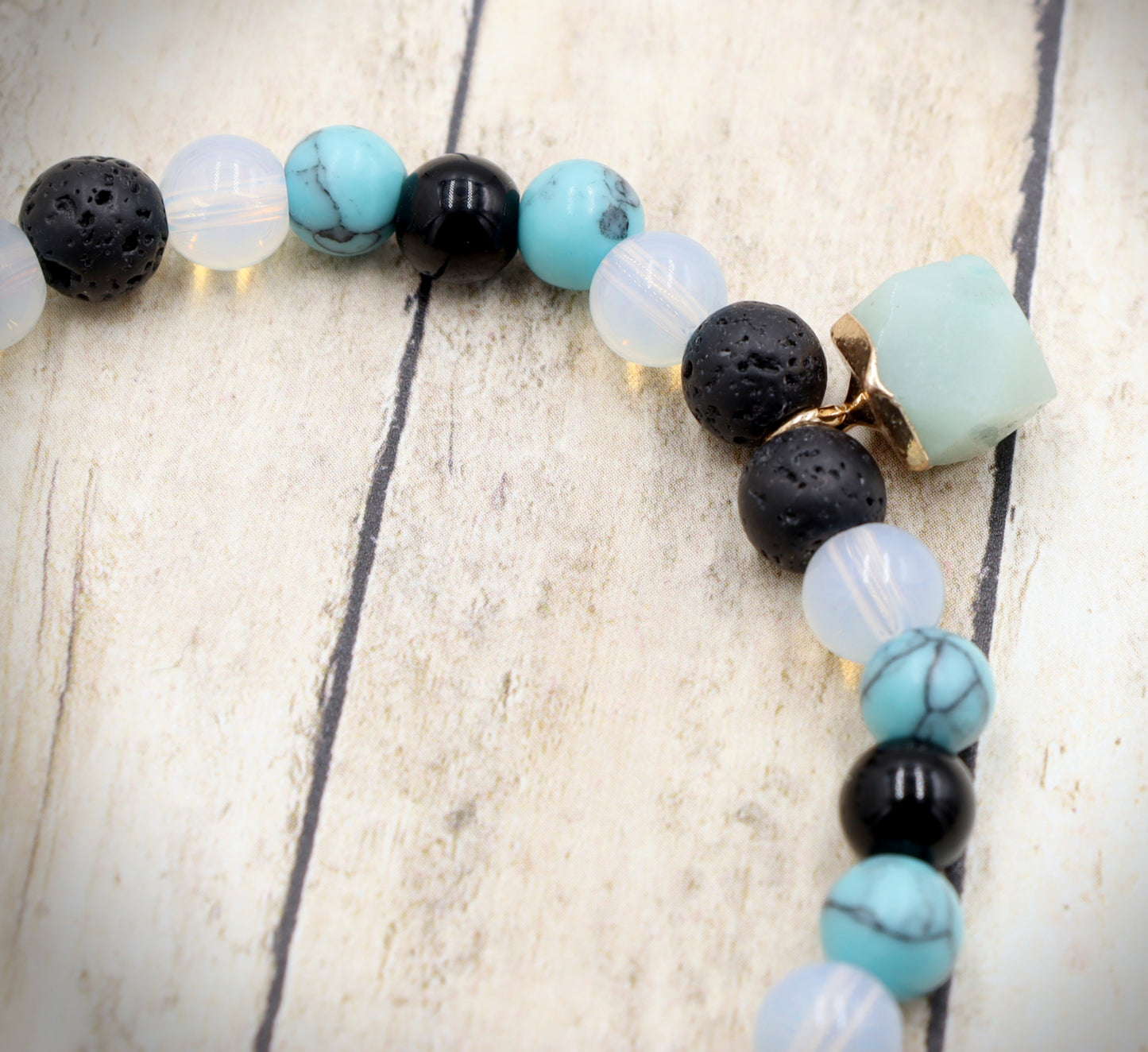 Head Over the Moon for Turquoise Blue and Black Lava Rock Golden Geometric Charm Bracelet