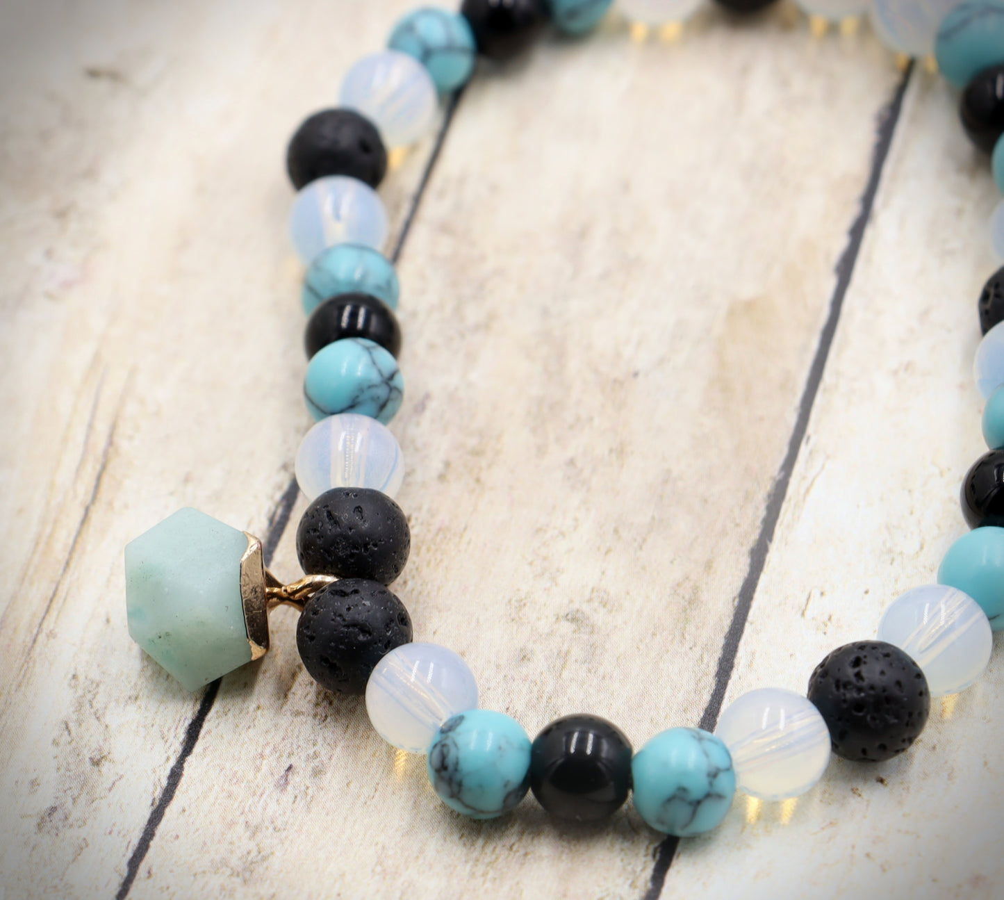 Head Over the Moon for Turquoise Blue and Black Lava Rock Golden Geometric Charm Bracelet