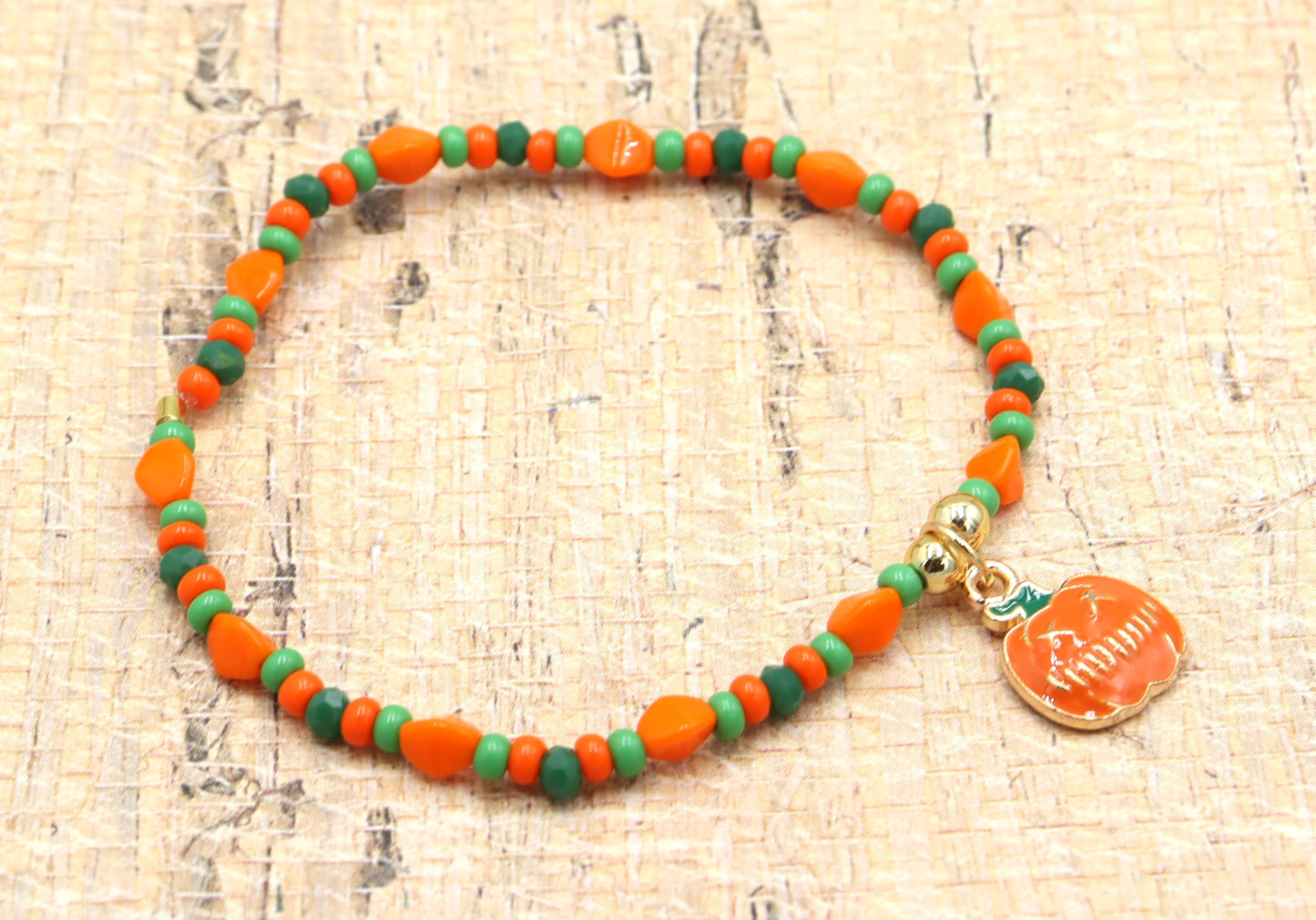 Orange and Green Scream Scary Craved Pumpkin Charm Bracelet by Monkey's Mojo Jewelry