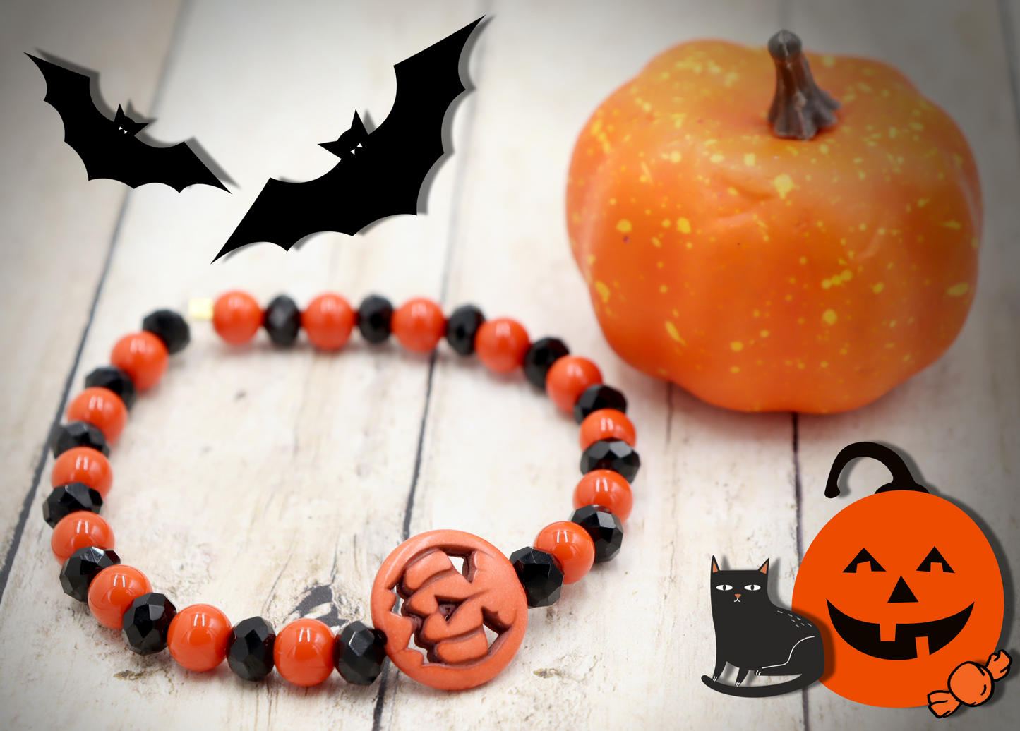 Tricking and Treating Classic Orange and Black Craved Pumpkin Glass Bead Stretch Bracelet by Monkey's Mojo