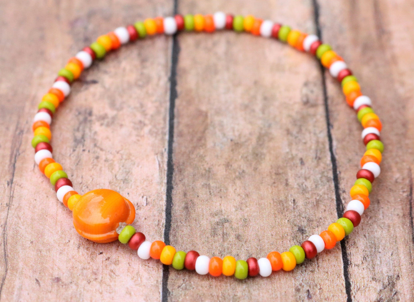 Fall in Love with A Glass Orange Sun - Red, Yellow, Green, and White Glass Bracelet Side View