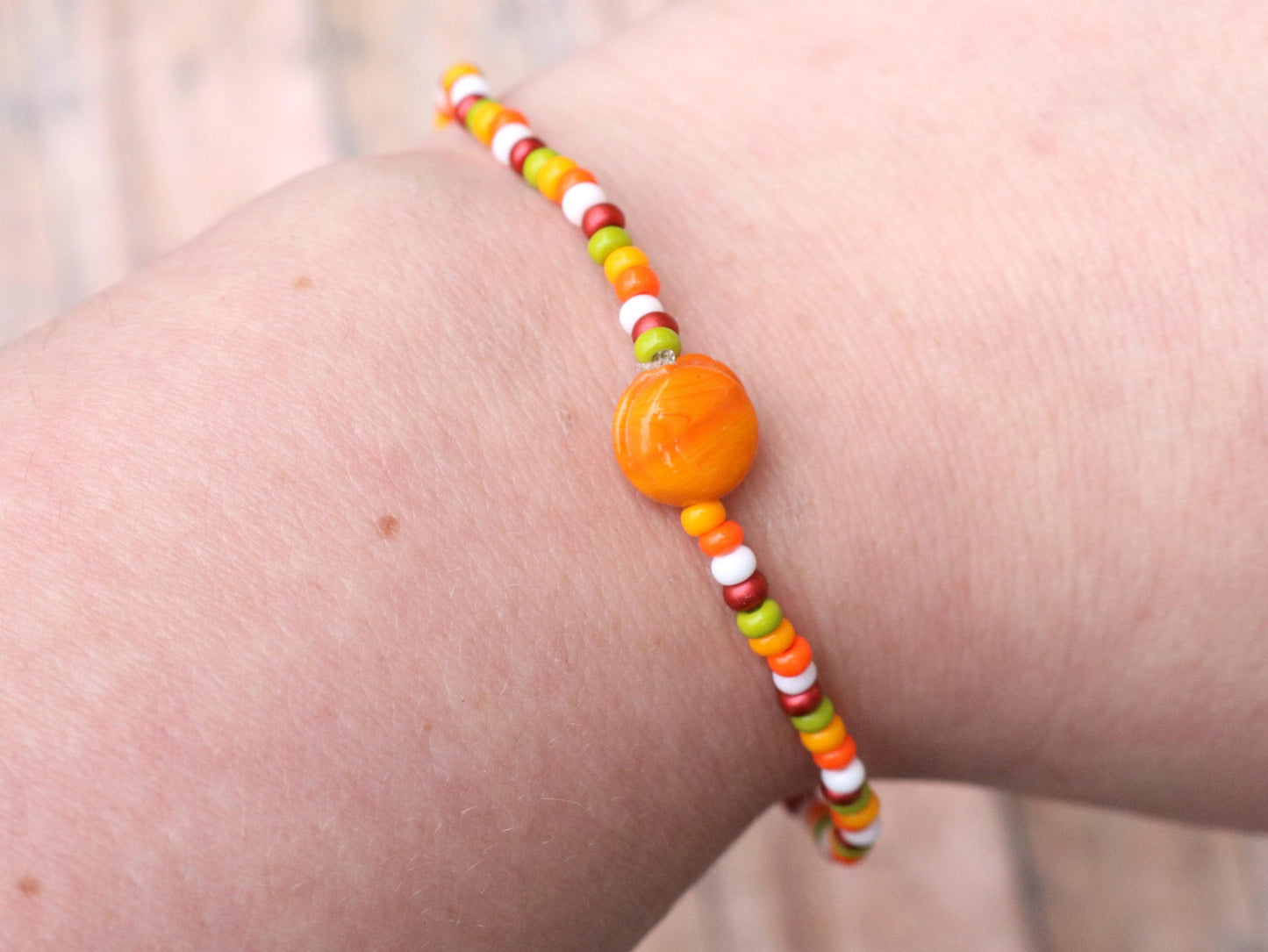 Fall in Love with A Glass Orange Sun - Red, Yellow, Green, and White Glass Bracelet On Model