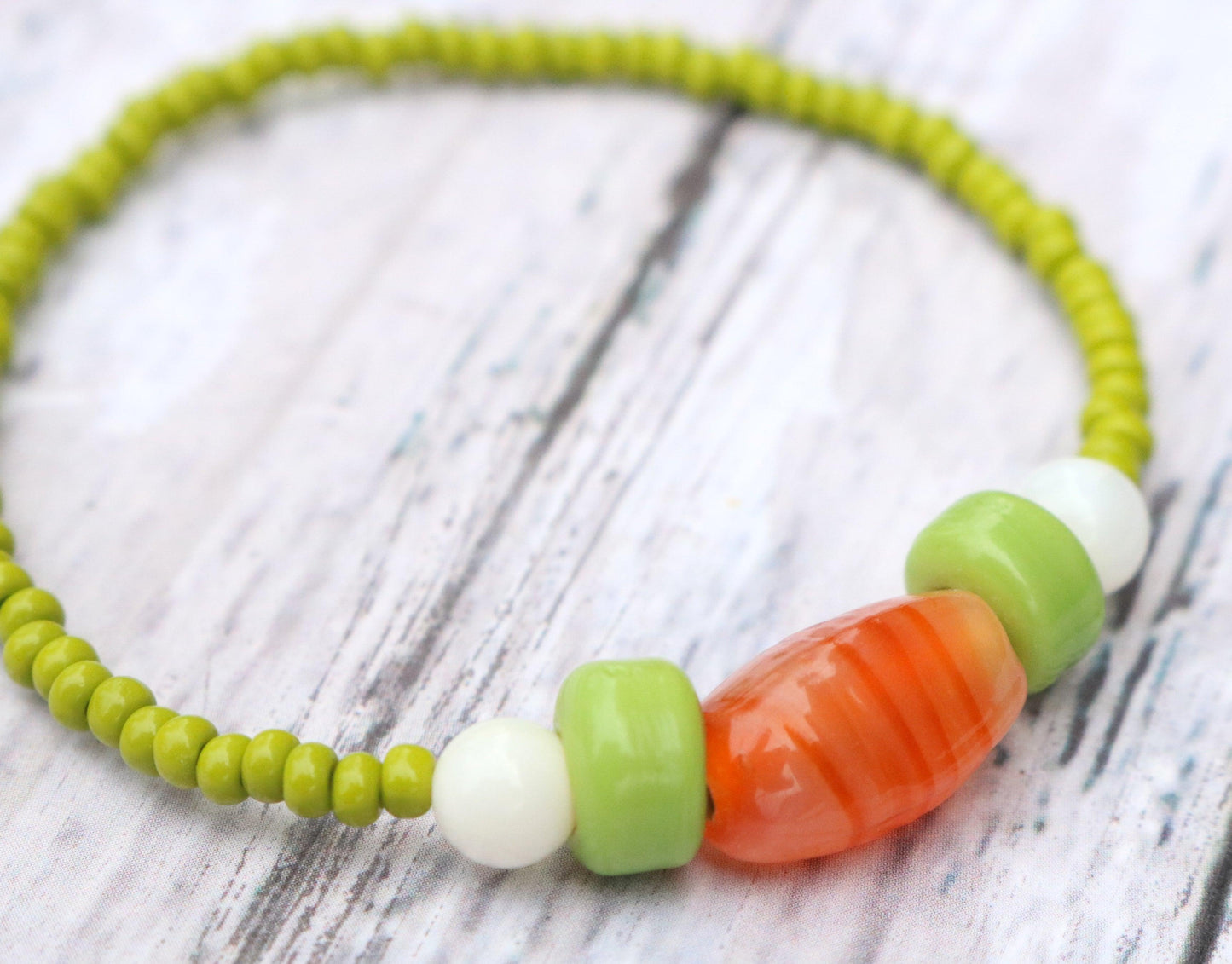 Bunny Hop Carrot Love Easter Treat Orange and Green Glass Bracelet Up Close