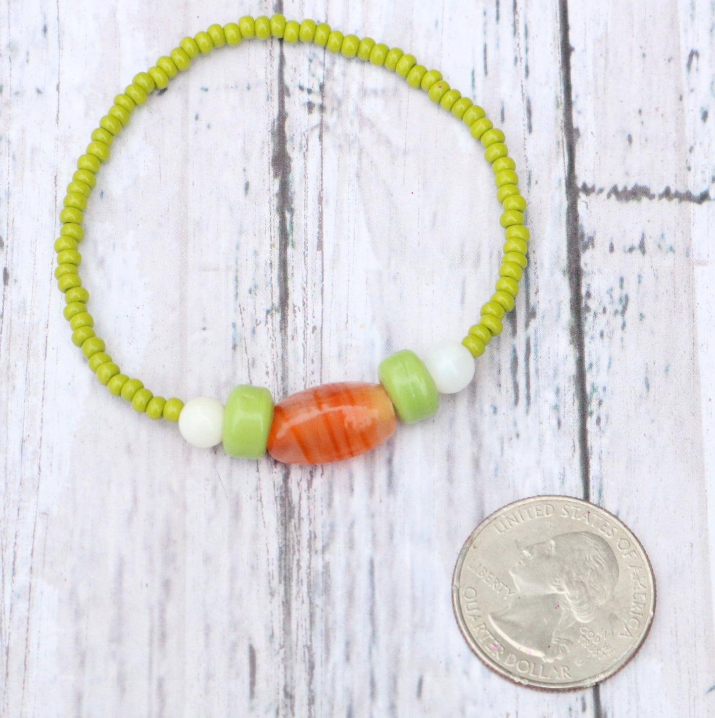 Bunny Hop Carrot Love Easter Treat Orange and Green Glass Bracelet Coin Comparison Size