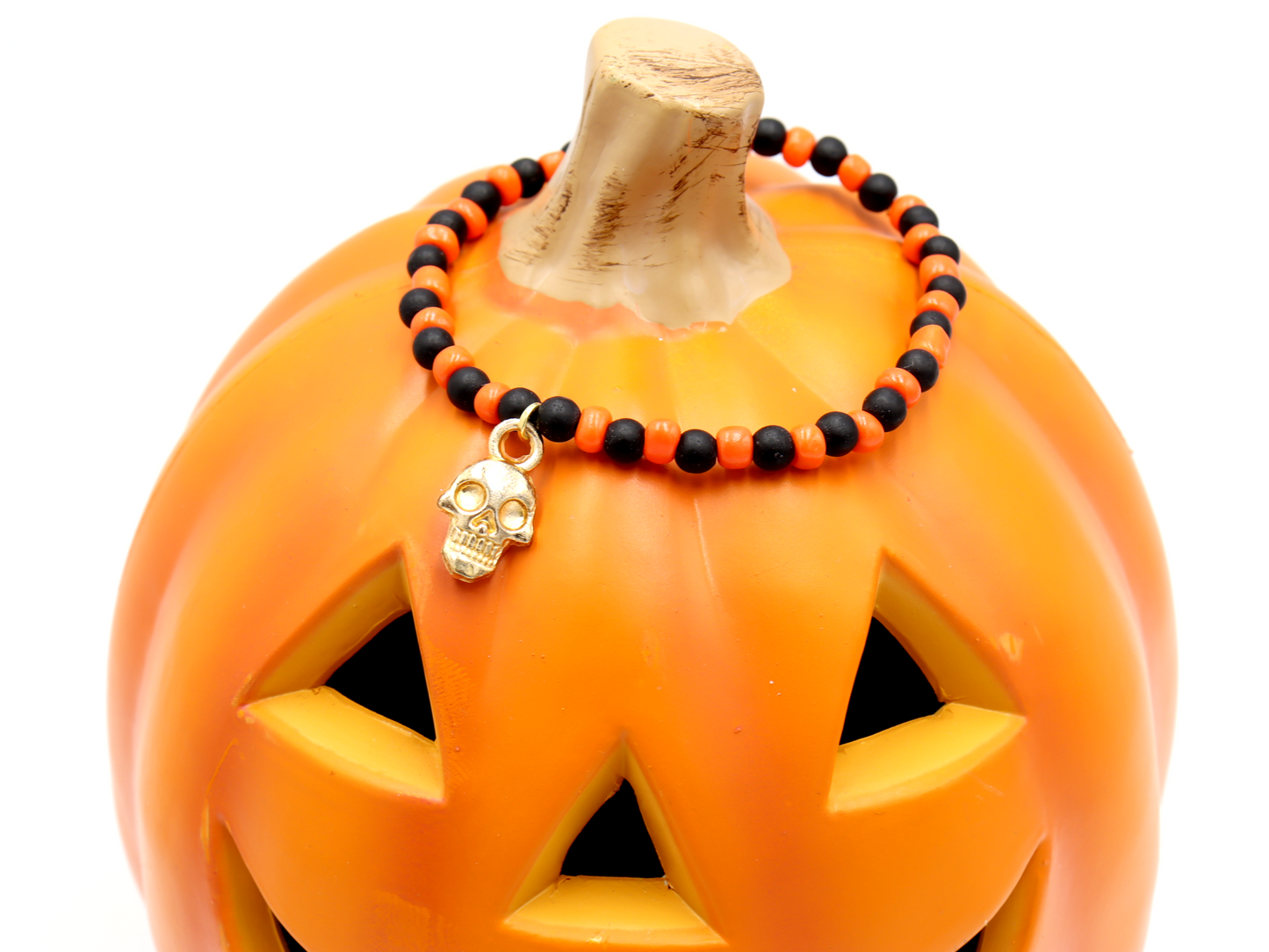 Classic Orange and Black Trick or Treat Yellow Gold Tone Skull Charm Halloween Stretch Bracelet by Monkey's Mojo