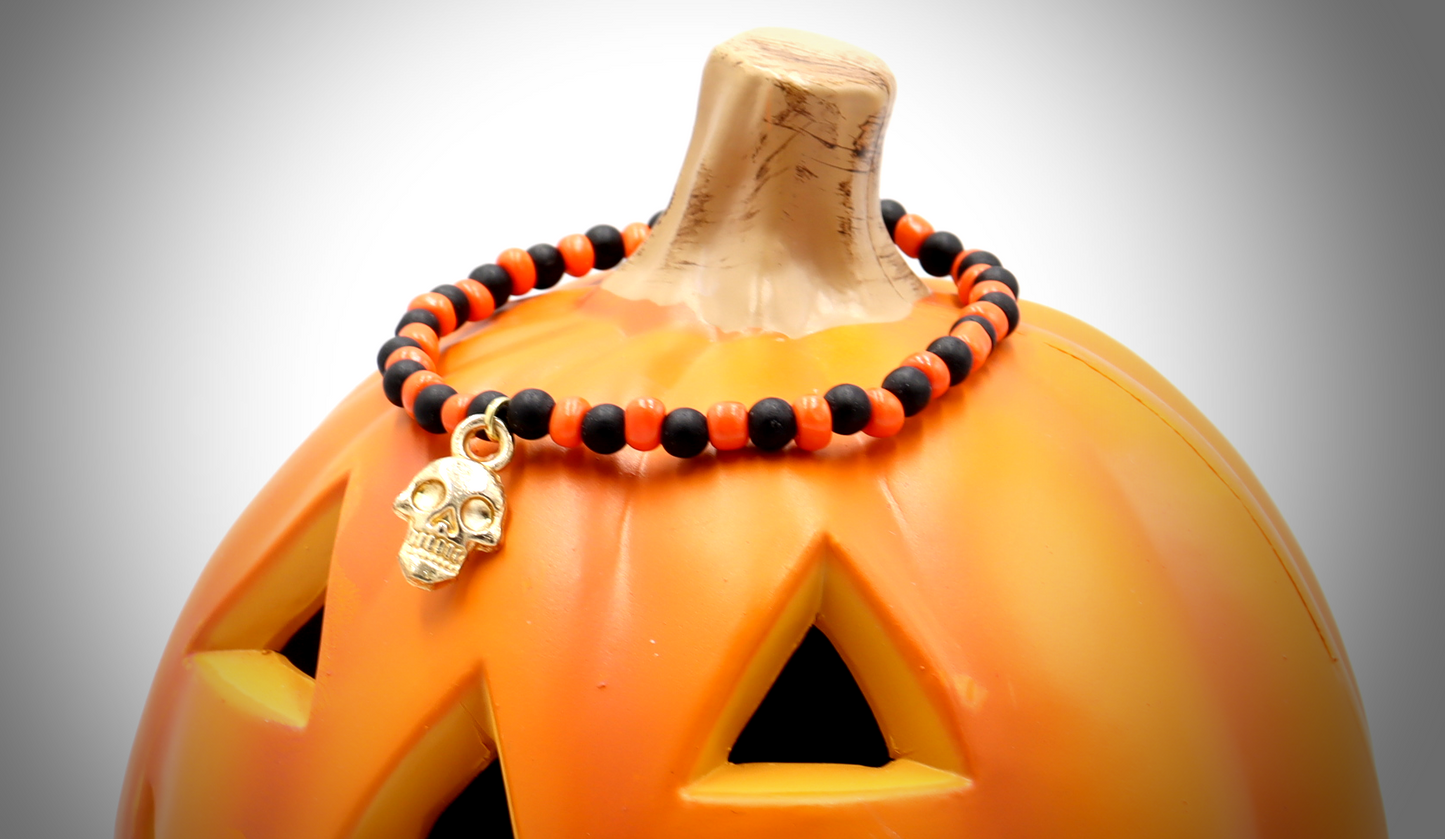 Classic Orange and Black Trick or Treat Yellow Gold Tone Skull Charm Halloween Stretch Bracelet by Monkey's Mojo