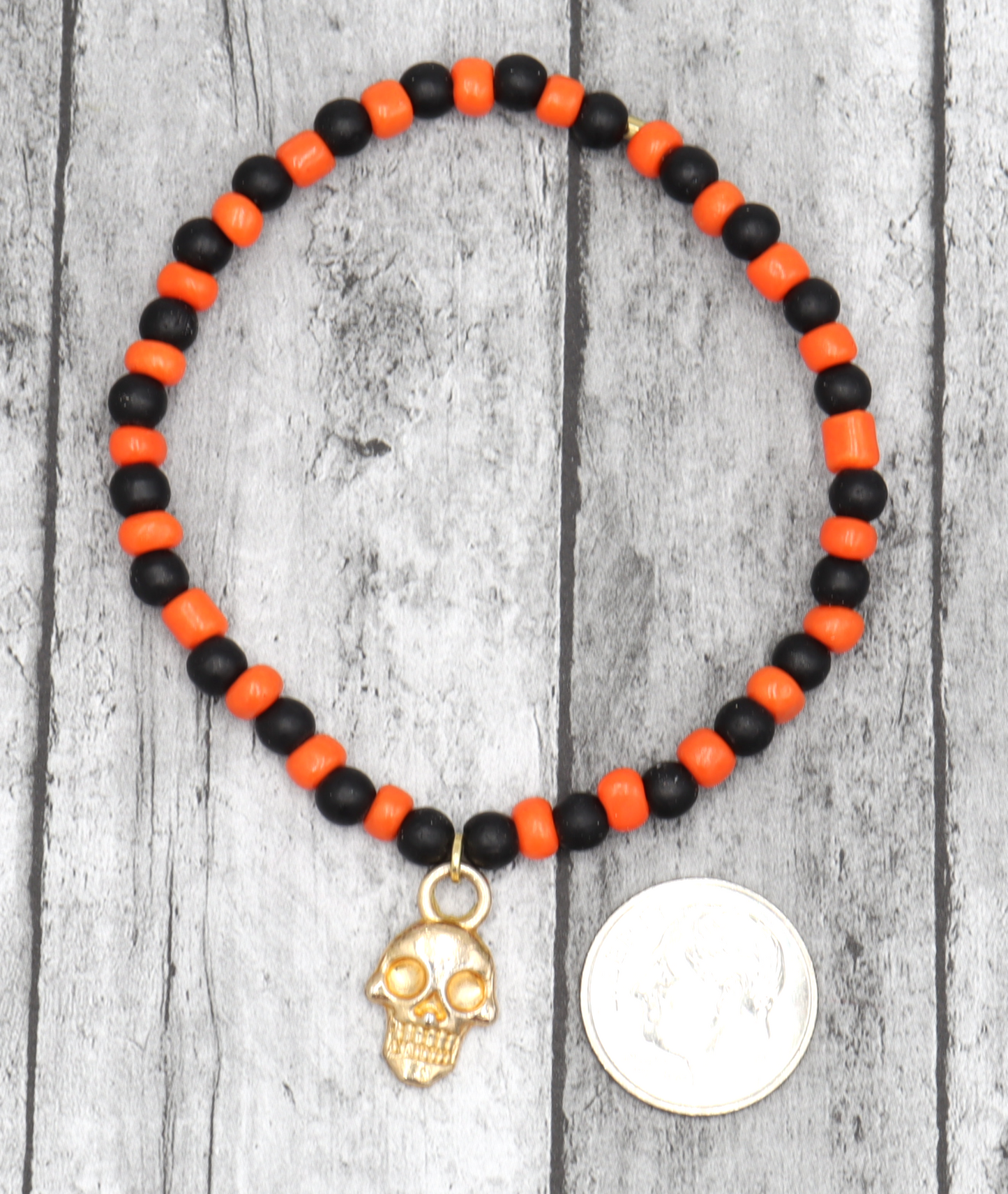 Classic Orange and Black Trick or Treat Yellow Gold Tone Skull Charm Halloween Stretch Bracelet by Monkey's Mojo