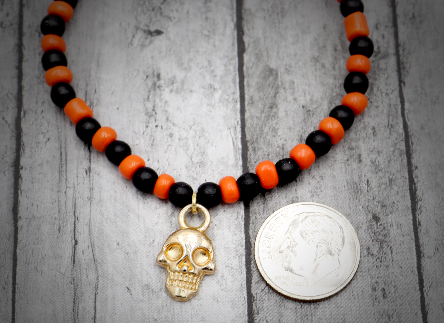 Classic Orange and Black Trick or Treat Yellow Gold Tone Skull Charm Halloween Stretch Bracelet by Monkey's Mojo